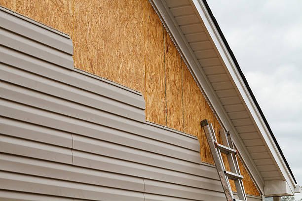 Professional Storm Damage Siding Repair technician working in Pleasant Plain, OH